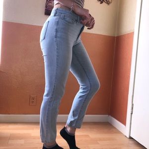 Light washed blue jeans, no rips.